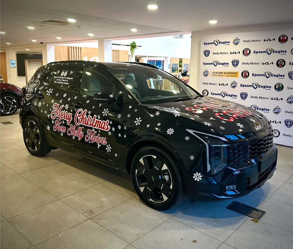 Birchwood Kia Chichester seasonal showroom car graphics