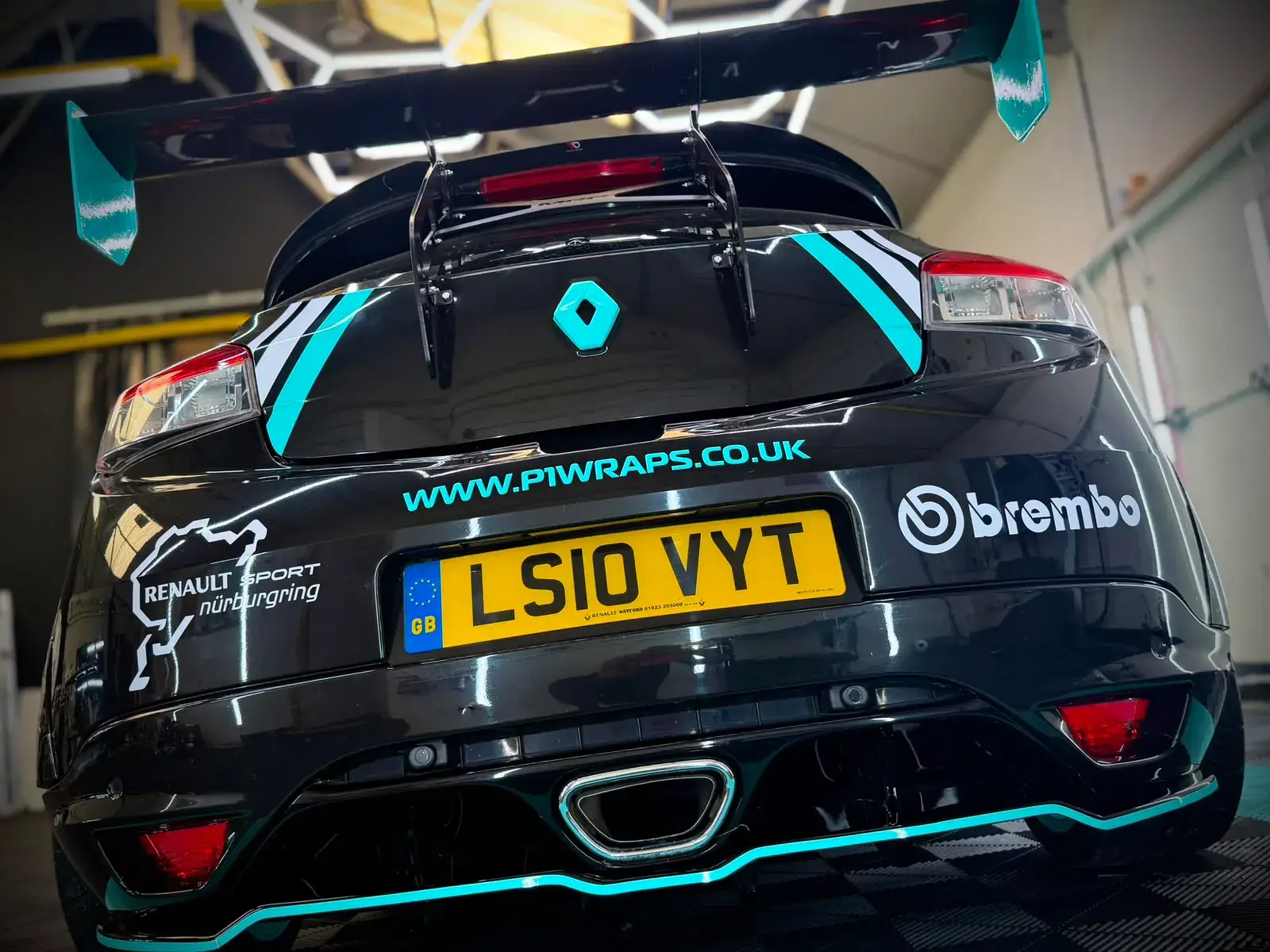 Rear of the car with Brembo, Renault Sport and P1 Wraps decals