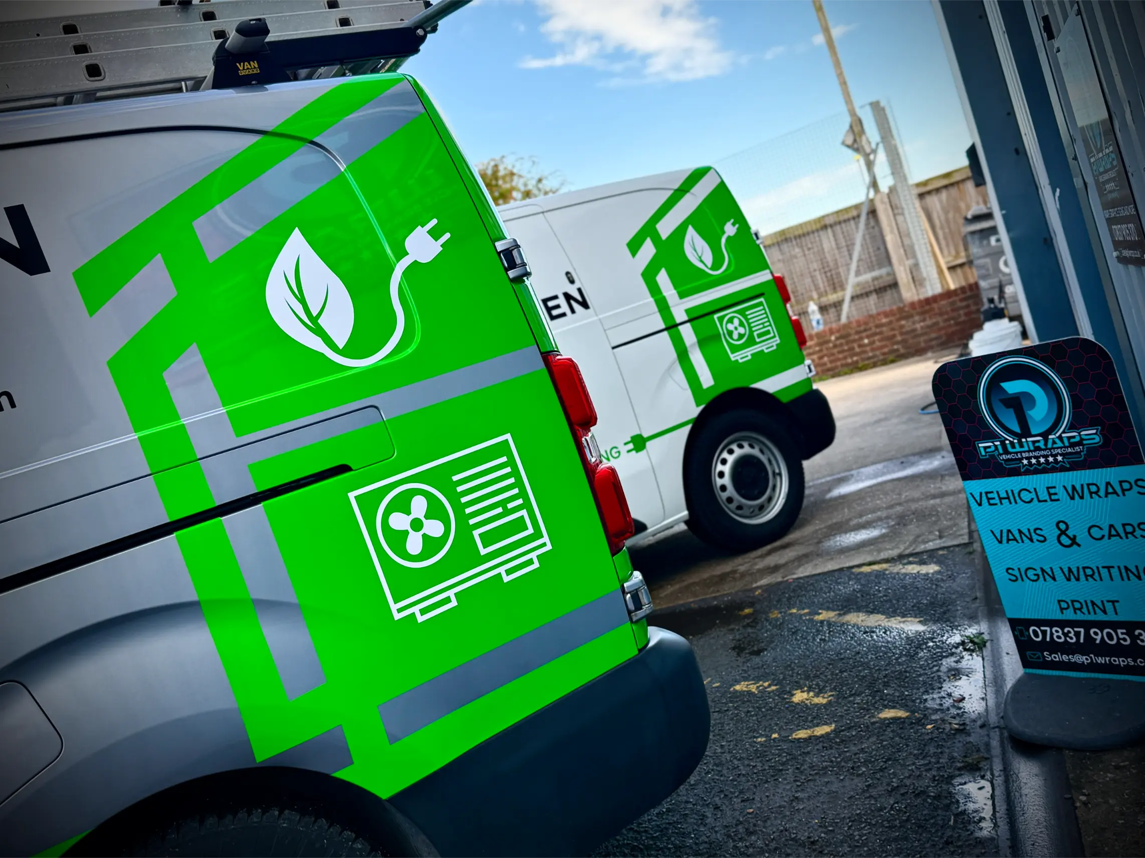 White service van with green partial vehicle wrap