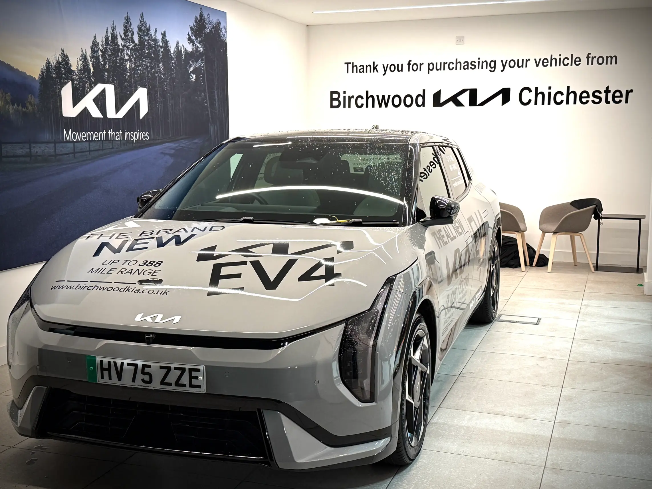 Kia EV4 showroom graphics at Birchwood Kia Chichester