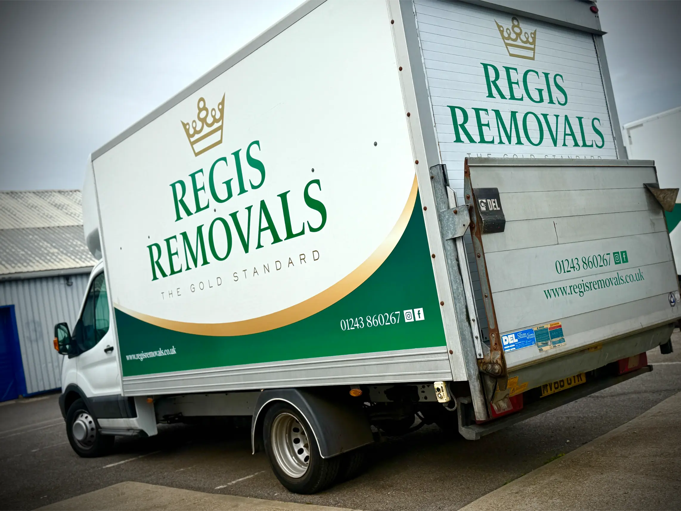 Regis Removals box truck with full side-panel branding