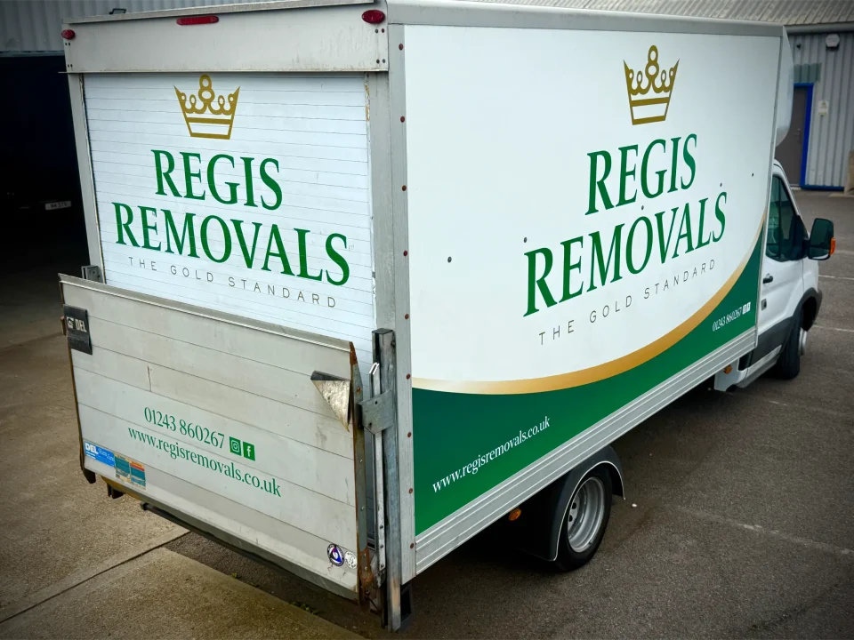 Rear and side view of a Regis Removals truck with full vehicle graphics by P1 Wraps